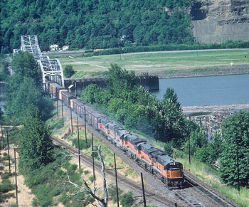 Milwaukee Road GEs haul the daily northbound freight across the Willamette River Swing Bridge